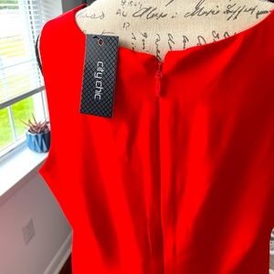 Asymmetrical faux wrap dress. Perfect for date night, the office or parties.